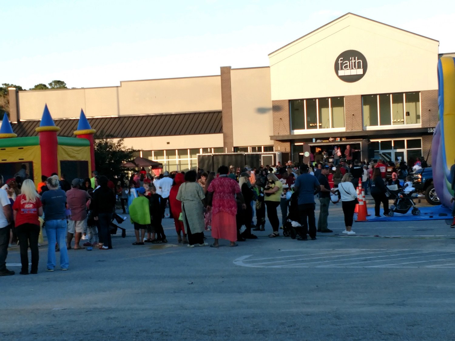 FESTIVAL GOERS. A community-wide Harvest Festival was held on Sunday, October 31st at the Faith Church parking lot on Bells Highway in Walterboro. From 4:00-7:00 p.m., costumed children enjoyed giant jump castles, slides, obstacle courses, carnival games, Trunk or Treat, food and fun.