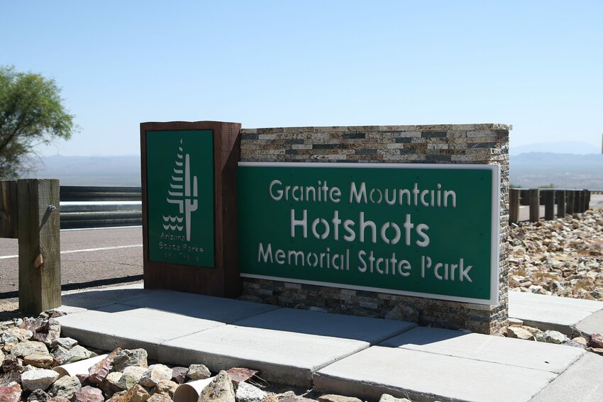 A sign marks the site of the Granite Mountain Hotshots Memorial State Park in Yarnell. The park features a seven-mile round trip hike to the location where the Hotshots were found after the tragedy in 2013. (Photo by Joey Plishka/Cronkite News)