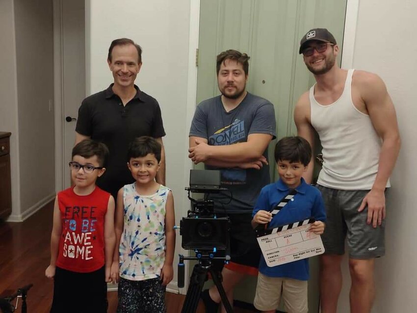 Justin Rose, center top, poses with fellow filmmakers Chris Studenka, upper left, and Greg Wave and three children from the movie Run Rabbit, (Courtesy Run Rabbit)