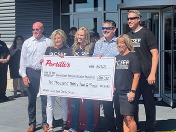 Michael Portillo, third from right, presents a check to the Queen Creek Schools Education Foundation at the Queen Creek Portillo's grand opening ceremony Aug. 29.