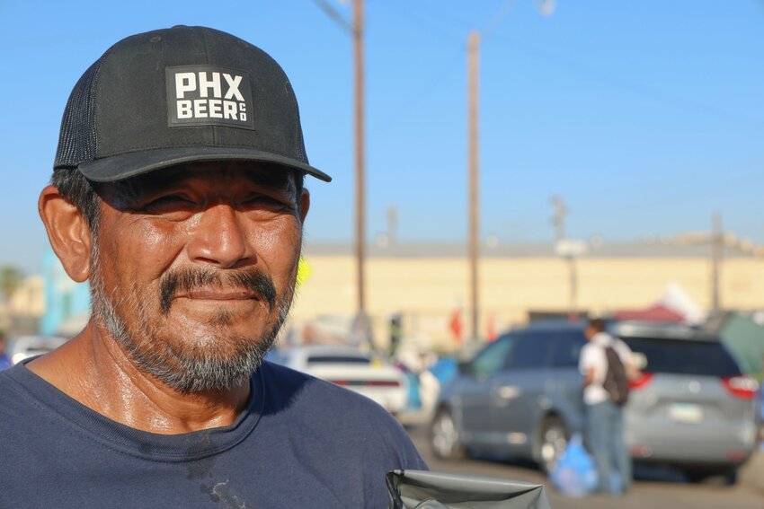 Lyle Daniels, who says he has lived in The Zone for a year after a series of surgeries left him in severe medical debt, watches the clearing of the encampment block by block. (Photo by John Leos/Cronkite News)