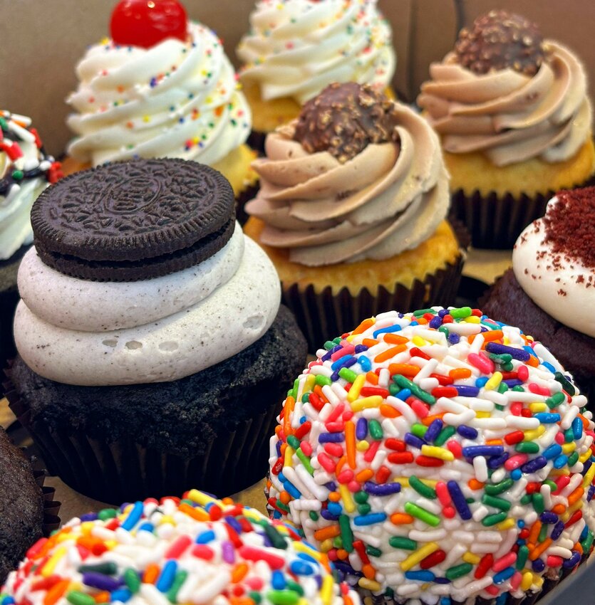 The Oreo-topped “Cookies & Cream” cupcake, left, and other items in this photo show some of the variety of the desserts and other treats found at Toasted Mallow of Chandler.