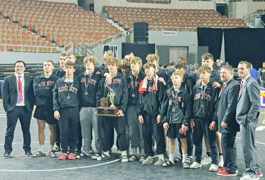 The Liberty boys wrestling team poses for a photo Saturday during the state championships at Veterans Coliseum after placing second in Division 1 behind dominant Sunnyside.
