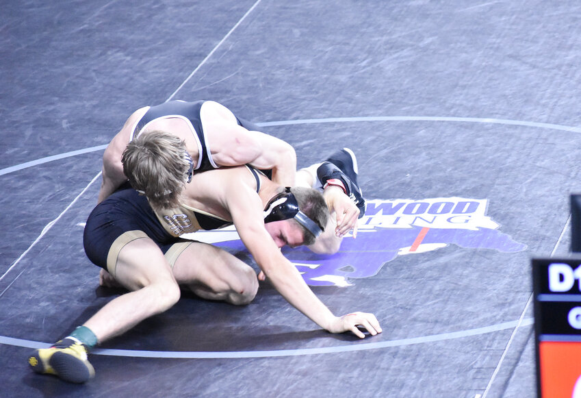 Shadow Ridge’s Nicholas Albertson, bottom, battles 138-pound top seed Keegan Green of Liberty at Feb. 17 in the state wrestling championships at Veterans Coliseum. Albertson, a junior, placed sixth in his weight class in the tourney. 