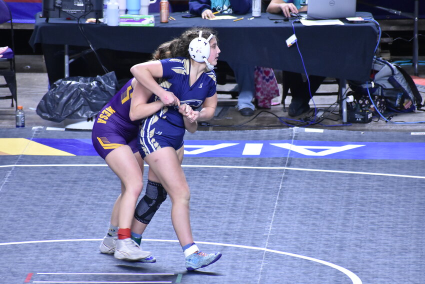 Casteel sophomore Izzy LeVine, right, tries to break free from Mesa’s Opal Jarvan in a 126-pound third-place match Feb. 17 in the state wrestling championships at Veterans Coliseum. 