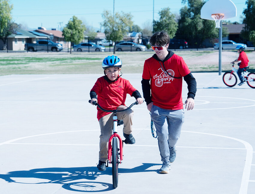 A young bicyclist is supervised at Hartford Sylvia Encinas Elementary. South Carolina-based nonprofit Going Places partnered with some Chandler organizations to provide 830 free bicycles to Hartford Encinas students. 