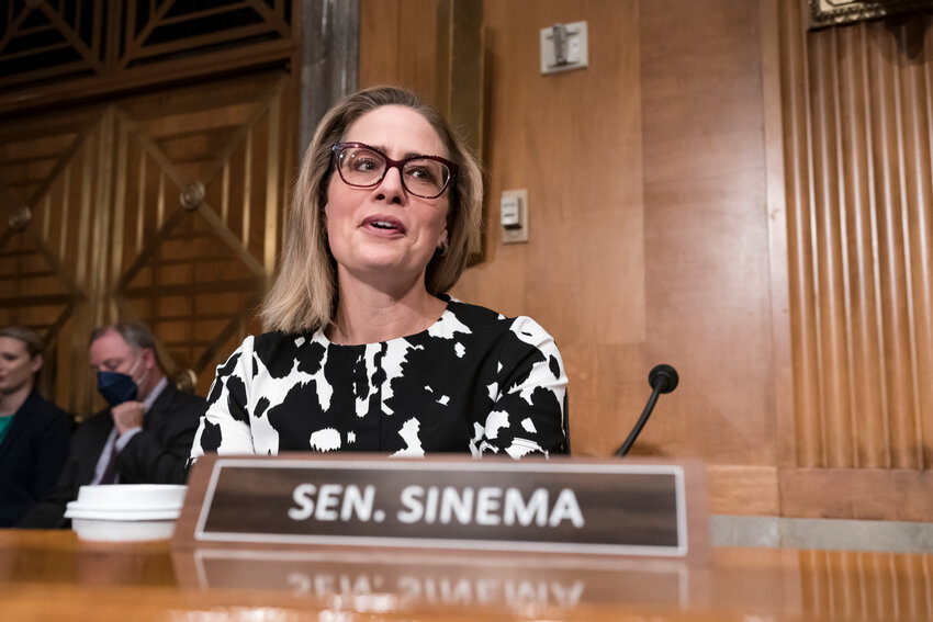 FILE -Then Sen. Kyrsten Sinema, D-Ariz., arrives for a meeting of the Senate Homeland Security Committee at the Capitol in Washington, Aug. 3, 2022.  Sinema has spent thousands of dollars out of her leadership PAC funds on flights and hotels.  (AP Photo/J. Scott Applewhite, File)