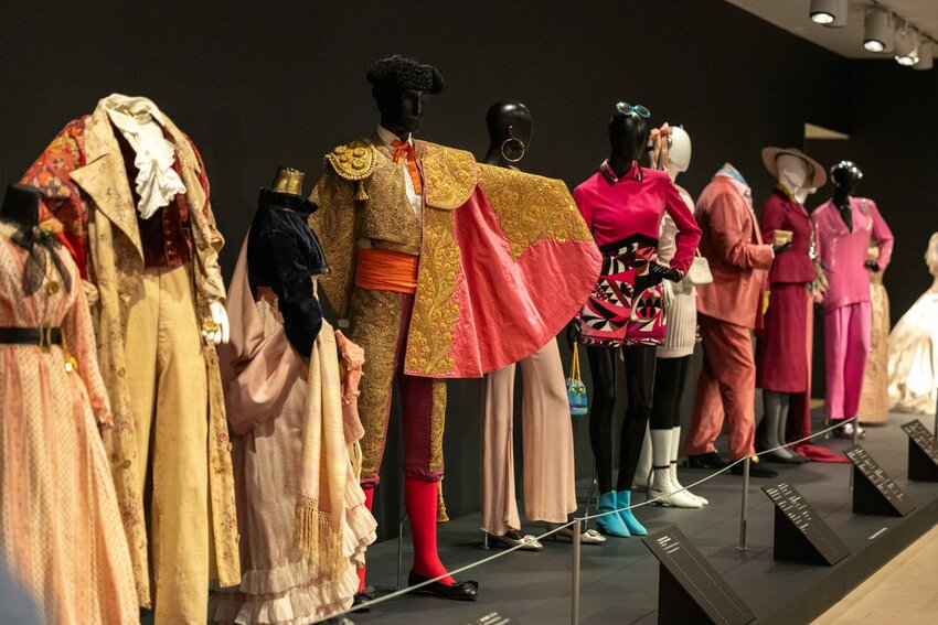 Outfits from the Phoenix Art Museum exhibition, “The Power of Pink,” showcase the use and expression of pink throughout fashion history. The exhibit is running alongside the “Barbie: A Cultural Icon” exhibition. Photo taken in Phoenix on Feb. 21, 2024. (Photo by Emily Mai/Cronkite News)