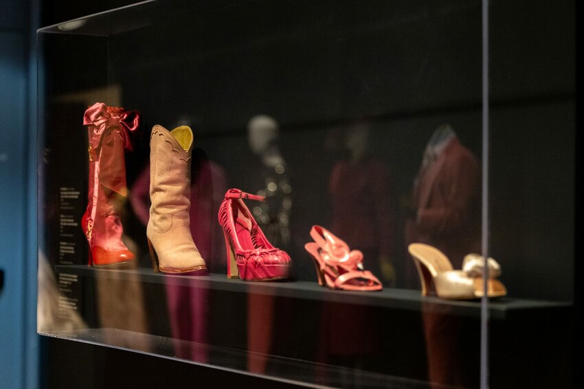 Various pink shoes from fashion history are displayed at the Phoenix Art Museum’s “The Power of Pink” exhibition. Photo taken in Phoenix on Feb. 21, 2024. (Photo by Emily Mai/Cronkite News)