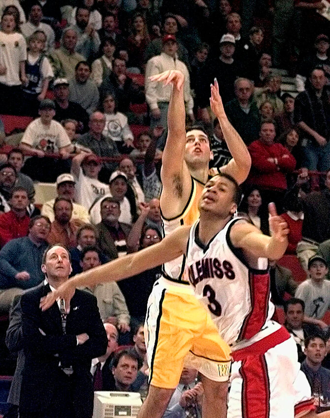 In this March 13, 1998, file photo, Valparaiso's Bryce Drew follows through on his game-winning 3-point shot at the buzzer over Jason Flanigan and Ole Miss in their first-round game of the NCAA Midwest Regional in Oklahoma City. At left is Valparaiso coach Homer Drew watching his son's shot.