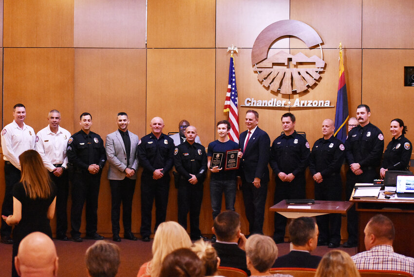 Chandler Mayor Kevin Hartke and the City Council recently presented a plaque to Ethan Cakmak, a Chandler teen and a student at Hamilton High School, for his quick thinking and lifesaving efforts  Feb. 7. Police officers and firefighters were at the council meeting to thank Cakmak for his efforts.
