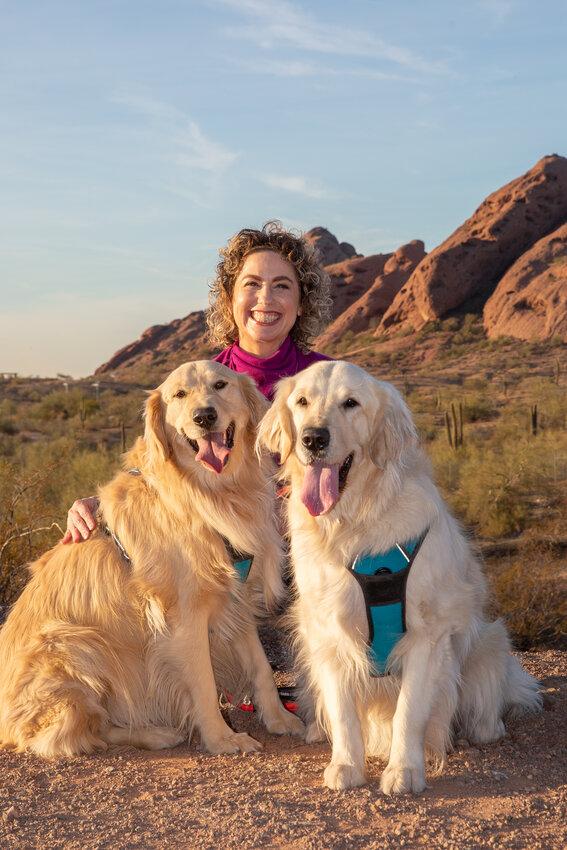 Emily Brumfield with her Golden Retrievers, Scout (left) and Bruce (right). (Photo courtesy of Flash and Hound Photography)
