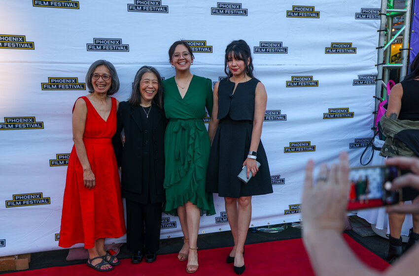 From left, Nina Newell, Cindy Lee, Phoebe Newell and Kat Aparicio pose for a photo during the Phoenix Film Festival’s opening night in Scottsdale on April 4, 2024. Lee’s film “The Stories They Didn’t Tell Us – Nina’s Story,” which recounts Nina Newell’s experiences as a refugee in Vietnam, premiered Thursday at the festival. “There’s so many aspects to the story, but part of it is the love of a mother and the intention with which she raised them (her children) to not put her trauma on them,” Lee says. (Photo by Kayla Mae Jackson/Cronkite News)