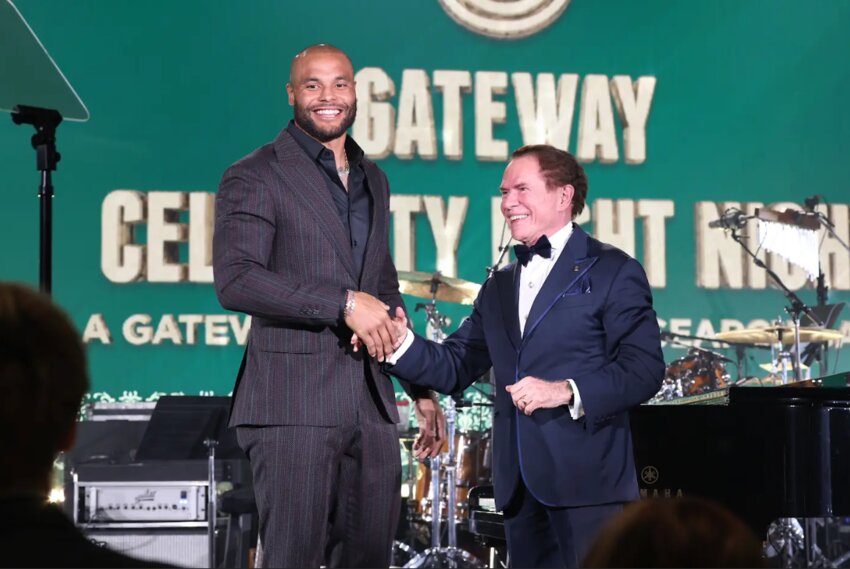 Mr. Richard J Stephenson (right) congratulates Dallas Cowboys quarterback Dak Prescott for receiving the Mary Brown Stephenson Award at the 2024 Gateway Celebrity Fight Night.