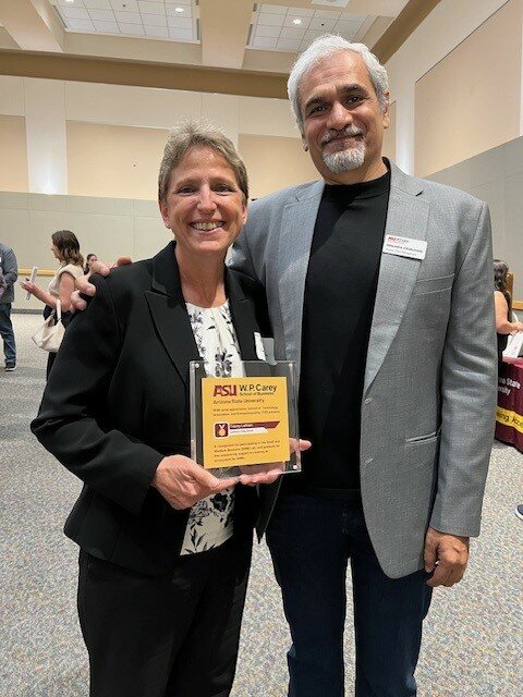 Business owner Tracey Latham poses with Hitendra Chaturvedi, supply chain expert and professor of practice at the W.P. Carey School of Business at ASU.  