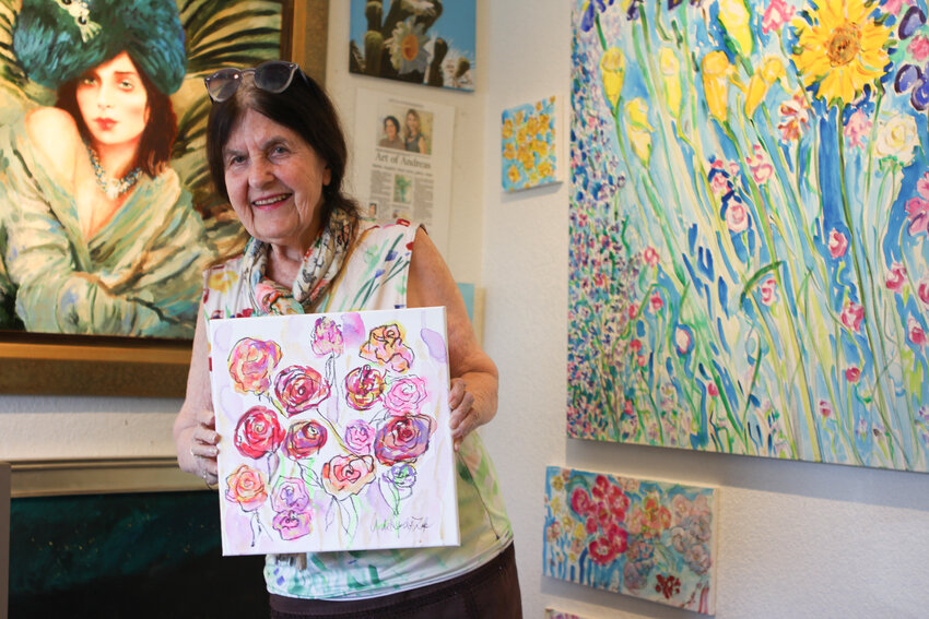 Andrea de Kerpely-Zak with a recent painting of roses for Mother’s Day. (Independent Newsmedia/Cyrus Guccione)
