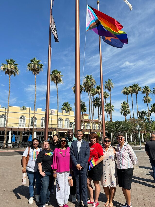 Chandler Pride members and Chandler city leaders gathering for the raising of a Pride flag is one of the few outdoor daytime events held in June in the Valley. The reality of June weather means many Pride events in the Valley have been moved to October or November.