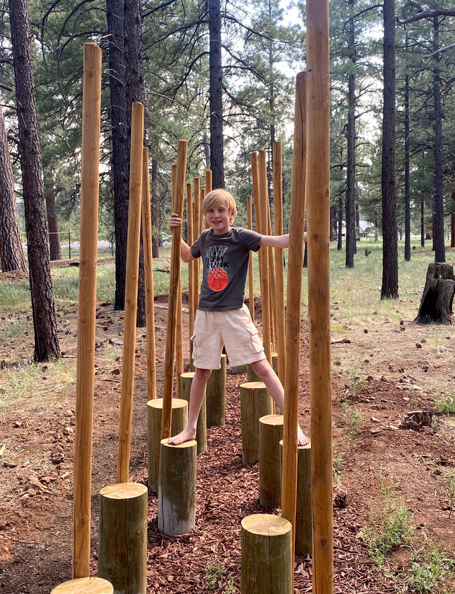 Ezra tries The Barefoot Trail’s log step walk.