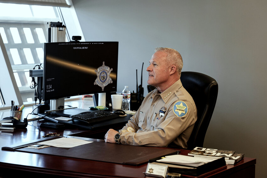 Maricopa County Sheriff Russ Skinner sits at his office desk on Tuesday, June 18, 2024, in Phoenix. Skinner says election safety is a top priority. (Photo by Shelby Rickert/News21)