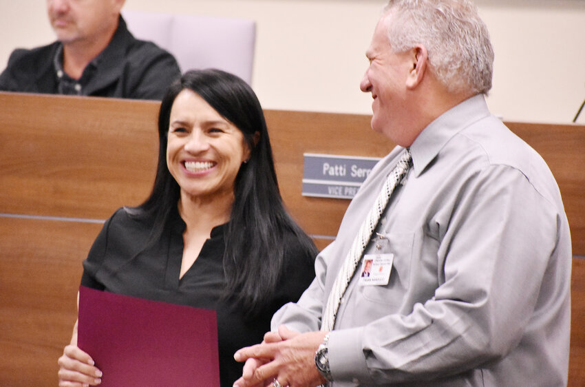 Rudy G. Bologna Elementary School Principal Patty Chinchilla smiles while hearing praise and standing next to Chandler Unified School District Superintendent Frank Narducci during a Hispanic Heritage Month recognition ceremony. 