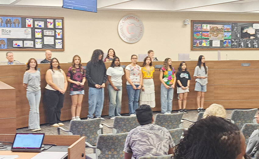 A group of Chandler Unified School District students prepare to individually read a few lines from the 1960s Chicano struggle poem “I am Joaquin,” by Rodolfo Corky Gonzales, during a Hispanic Heritage Month event.