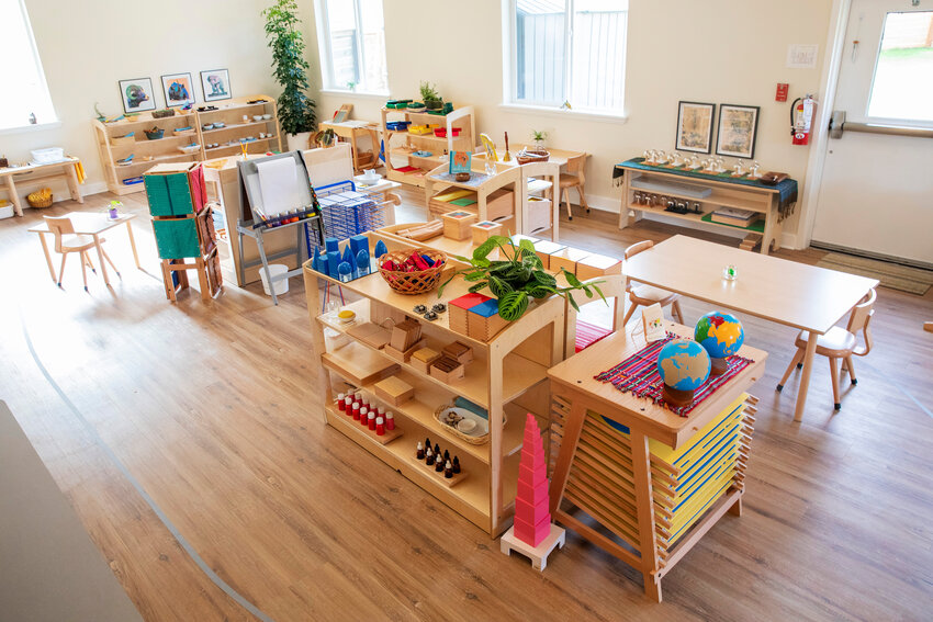 While each school looks a bit different, as this photo from a different campus shows, the shelves, materials and classroom set up are intentionally very similar.