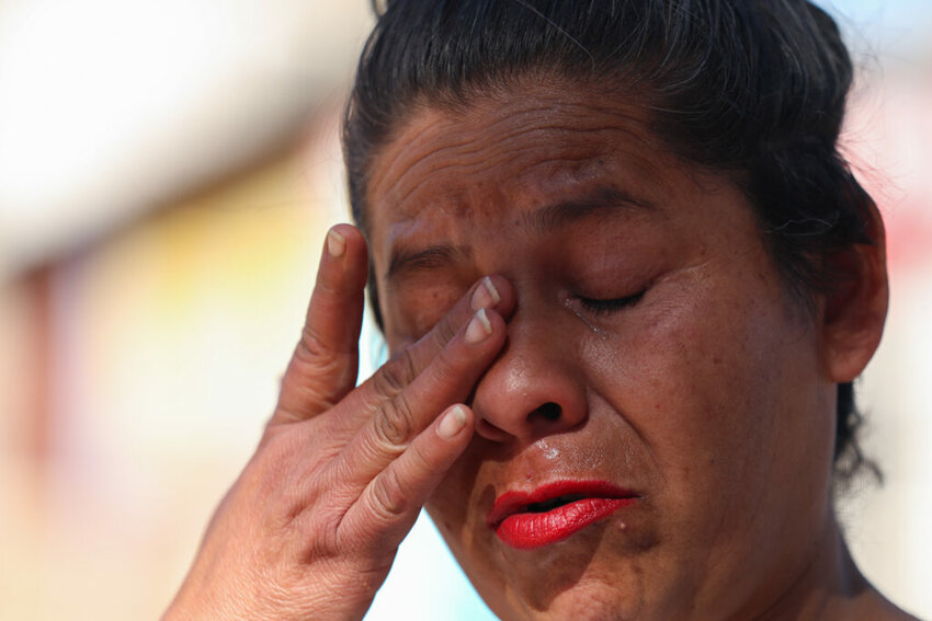 María Rosario Lopez gets emotional while sharing the story of her traumatic deportation and separation from her two sons on Feb. 24, 2025 in Nogales, Mexico. (Photo by Sydney Lovan/Cronkite News)
