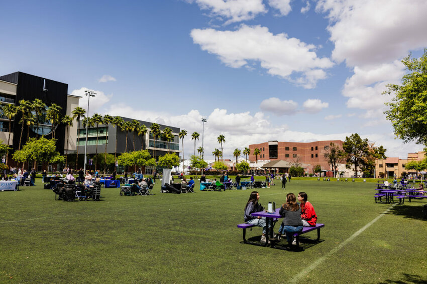 Grand Canyon University’s plush lawn and crisp purple benches stand in stark contrast to the peeling paint and cracked asphalt in the community outside its gates. Photo taken on April 2, 2025, in Phoenix. (Photo by Samuel Nute/Cronkite News)