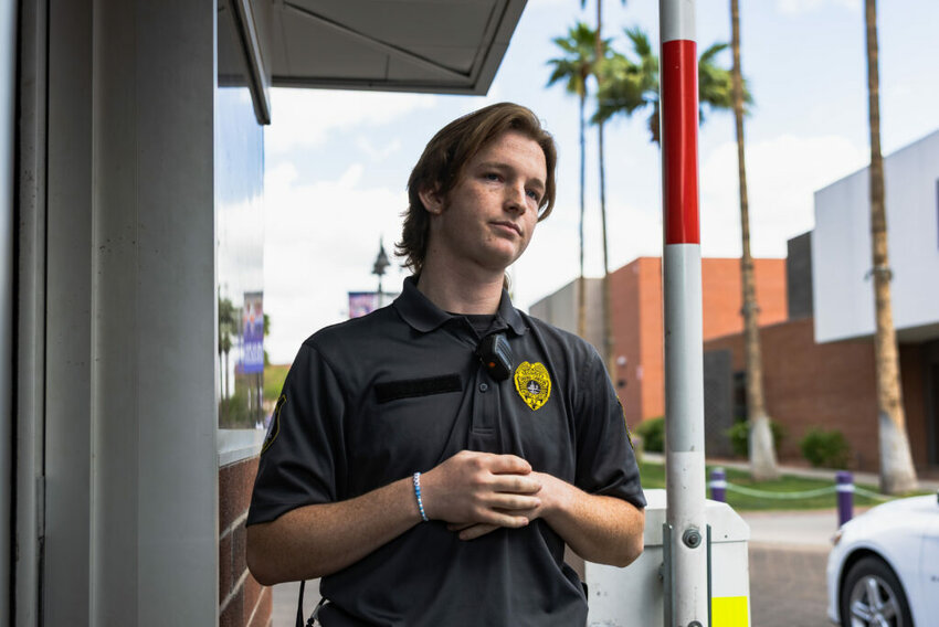 Grand Canyon University security guard Samuel South stands at his post at the 33rd Avenue entrance to GCU’s campus on April 2, 2025, in Phoenix. (Photo by Samuel Nute/Cronkite News)