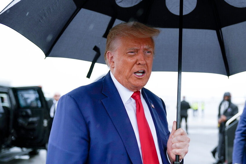FILE - Former President Donald Trump speaks before he boards his plane at Ronald Reagan Washington National Airport, Aug. 3, 2023, in Arlington, Va.  Trump was poised to win Arizona's Republican presidential primary on Tuesday.  (AP Photo/Alex Brandon, File)