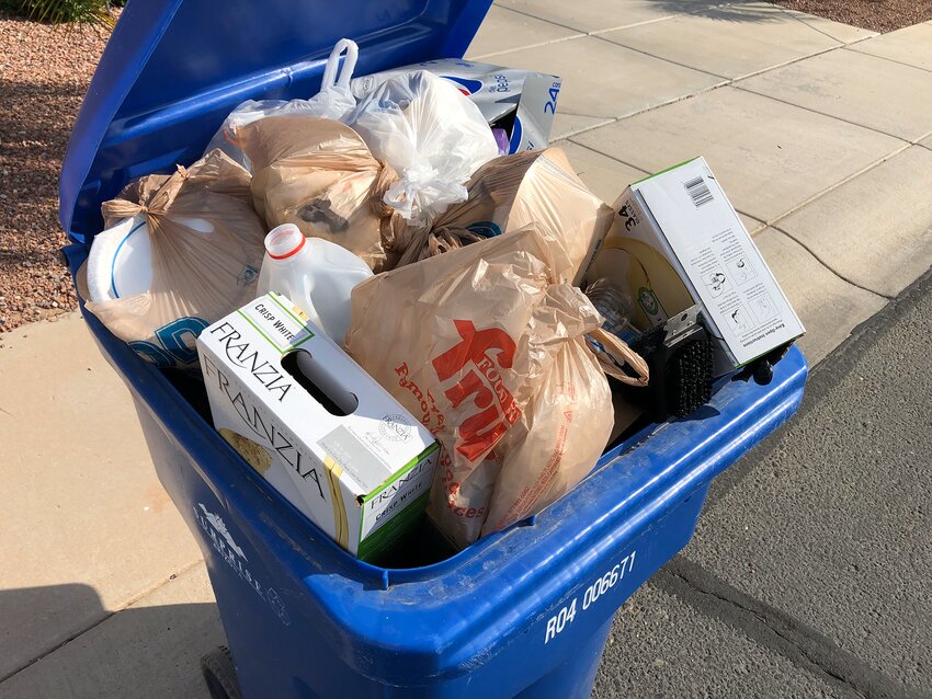Surprise officials will be educating residents on what to put in the blue recycling bins as the city relaunches curbside recycling service this week. Trash in plastic bags and used food boxes are considered contaminants in a recycling pile.