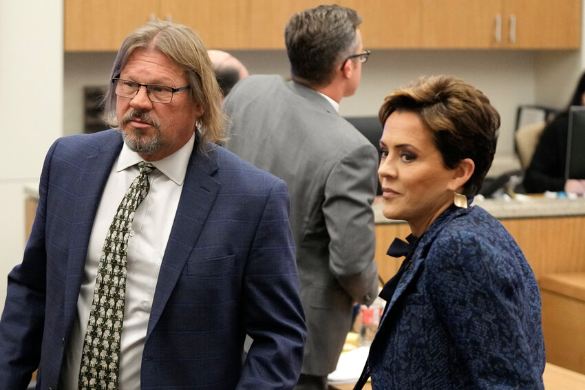 Former Arizona Republican governor candidate Kari Lake, right, stands next to her attorney Bryan Blehm at Maricopa County Superior Court during a voting records trial Thursday, Sept. 21, 2023, in Phoenix. (Associated Press/Ross D. Franklin, Pool)