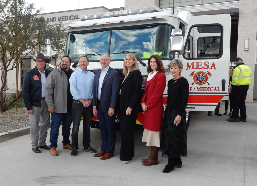 City of Mesa council members and the mayor pose in front of the new all-electric fire truck in the front of Fire Station 221, 9320 E. Point Twenty-Two Blvd. in Mesa.