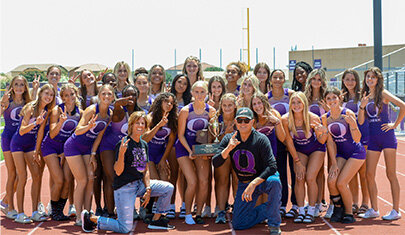 The head coach of Queen Creek High School's girls track and field program, Shaun Hardt, kneeling front row right, has been named the National Federation of State High School Association's Girls Track &amp; Field National Coach of the Year for the 2022&ndash;2023 season..&nbsp;