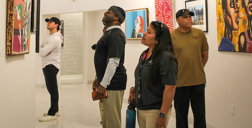 Visitors view &quot;Vision &amp; Sound: An African American Experience&quot; at the Georgia T. Lord Library in Goodyear.