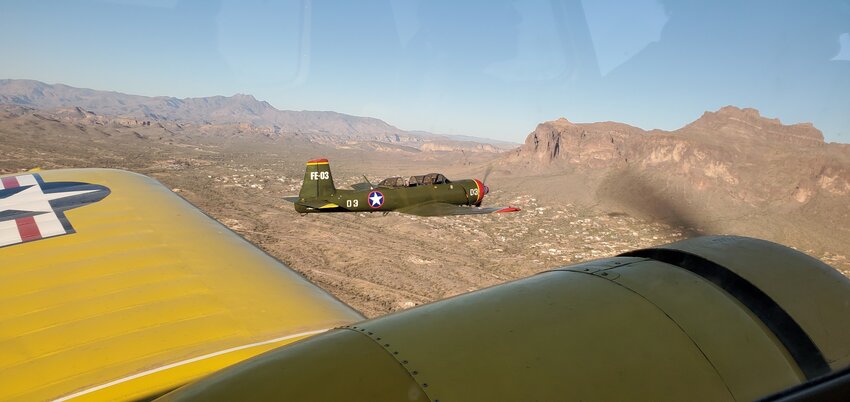 Pilots from the Falcon Warbirds Foundation mid-flight in Mesa.