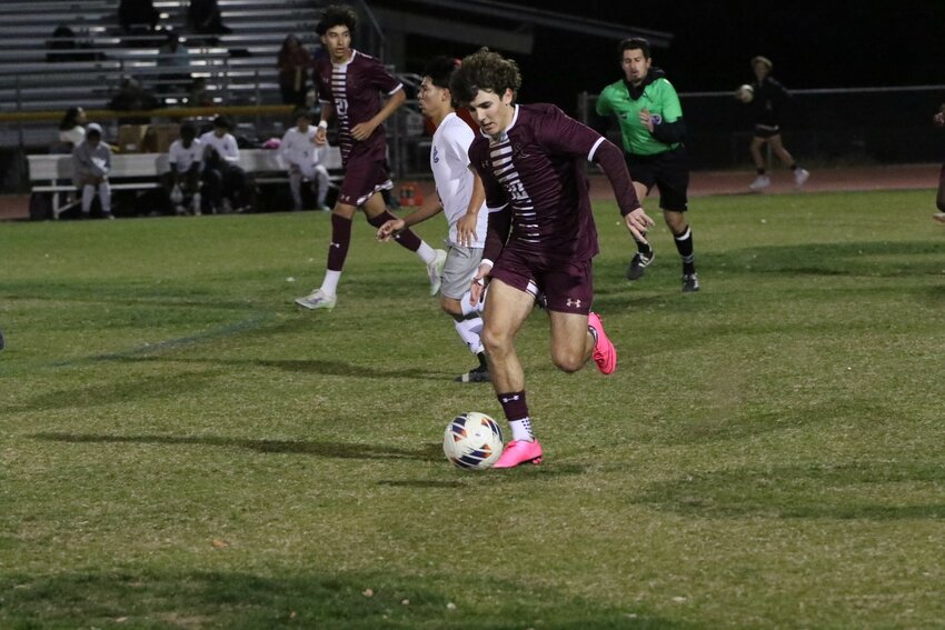 Junior striker Jacob Engwall dribbles upfield for Shadow RIdge during its season-ending home game against Laveen Cesar Chavez Feb. 1 in Surprise. The Stallions completed a 12-0 regular season.