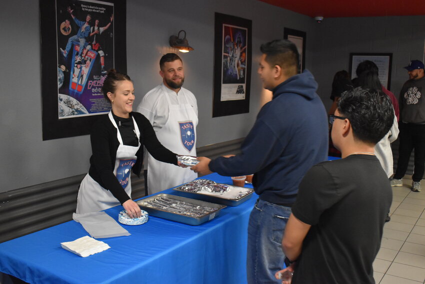 Chef Maria Arenas and chef Russell LaCasce serve breakfast burritos to the Boys &amp; Girls Barker Branch Club members. (Independent Newsmedia/George Zeliff)