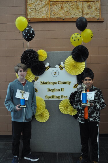 The top spellers in Maricopa County. Runner-up Finley Roberts, left, and champion Aneesh Kulkarni, right. (Submitted photo/SUSD)