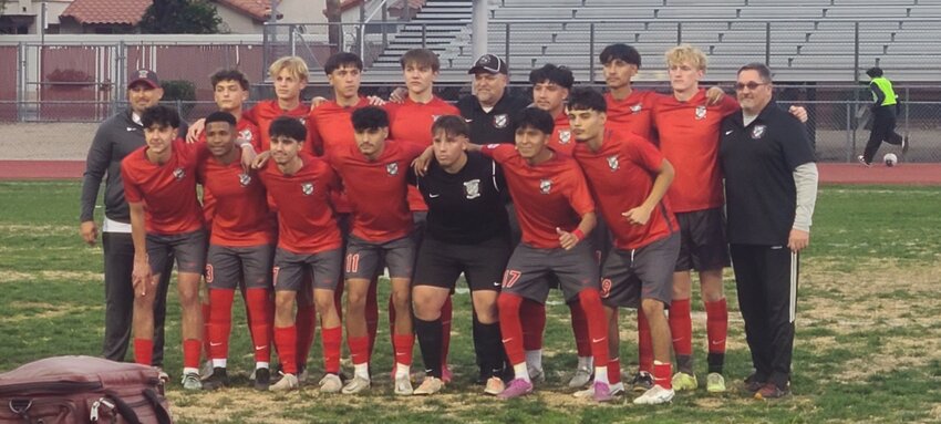 Ironwood Boys soccer's 14-player senior class stand after a game for a photo with the coaching staff, including coach Tim Beck, black shirt, middle of the second row, For the second straight year the Eagles are the No. 1 seed in 5A.