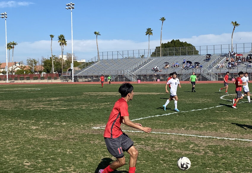 Ironwood senior defender Josh Granados prepares to cross the ball into the box during the second half of a 5A boys soccer quarterfinal win over Tucson Catalina Foothills.