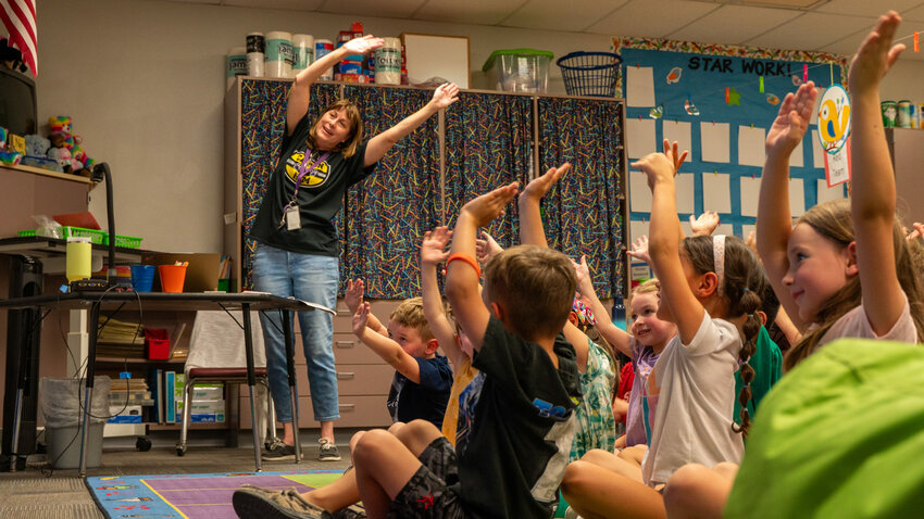 A teacher leads students at Canyon Rim Elementary School in Mesa.