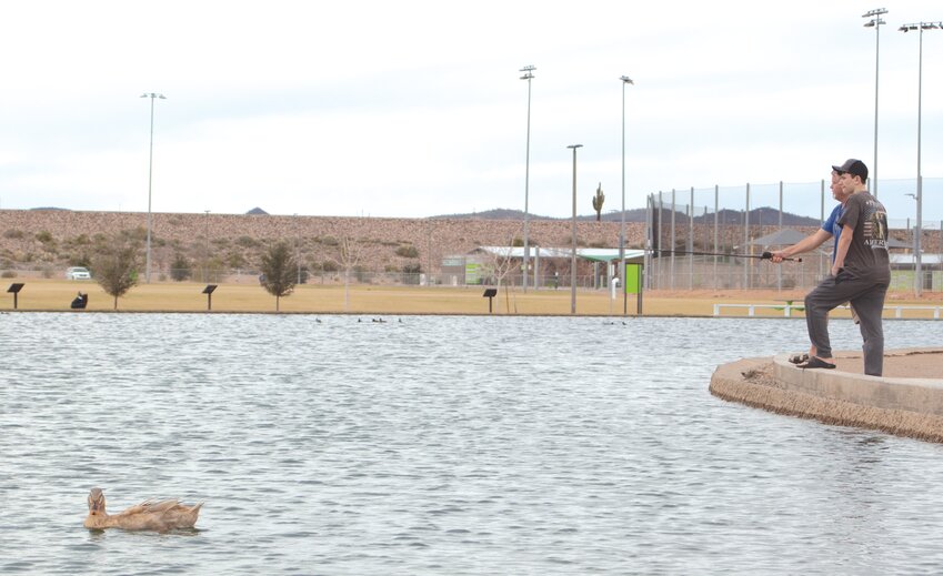 Urban fishers spend a recent afternoon at Paloma Park in north Peoria. The city of Peoria recently created a neighborhood parks condition index to ensure parity throughout the city&rsquo;s park system.