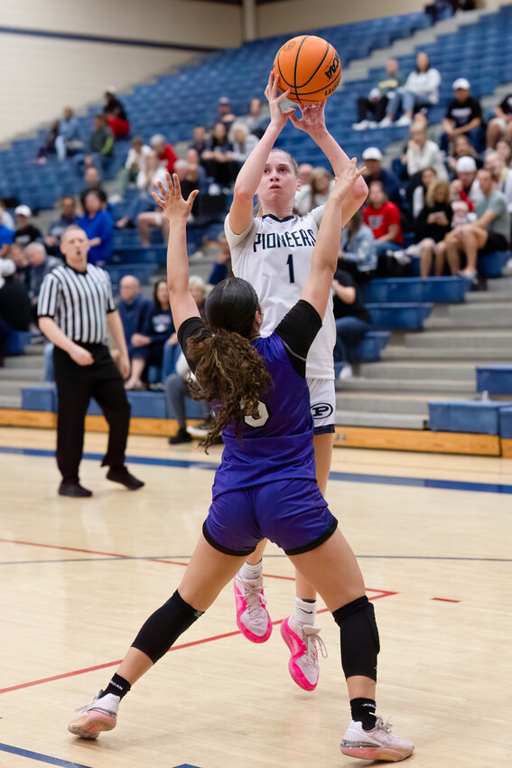 Phoenix Pinnacle junior forward Heather Steadman puts up a short jumper over the defense of Valley Vista freshman guard Braya Neal Tiffany during the Pioneers' Open Division quarterfinal win Feb. 22 at home.
