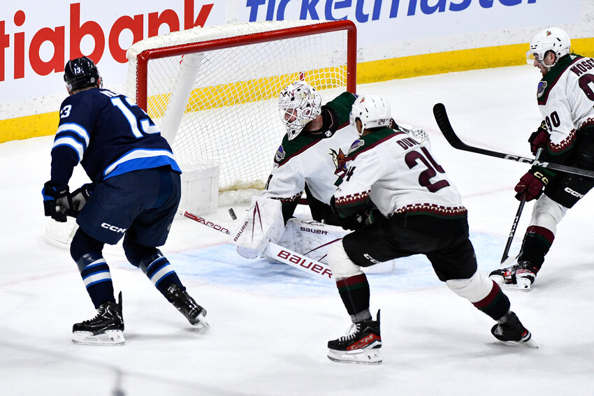 Winnipeg Jets center Gabriel Vilardi, No. 13, scores on Arizona Coyotes goaltender Connor Ingram in Sunday&rsquo;s game. The 4-3 overtime road loss was the Coyotes&rsquo; 14th defeat in their past 16 games.