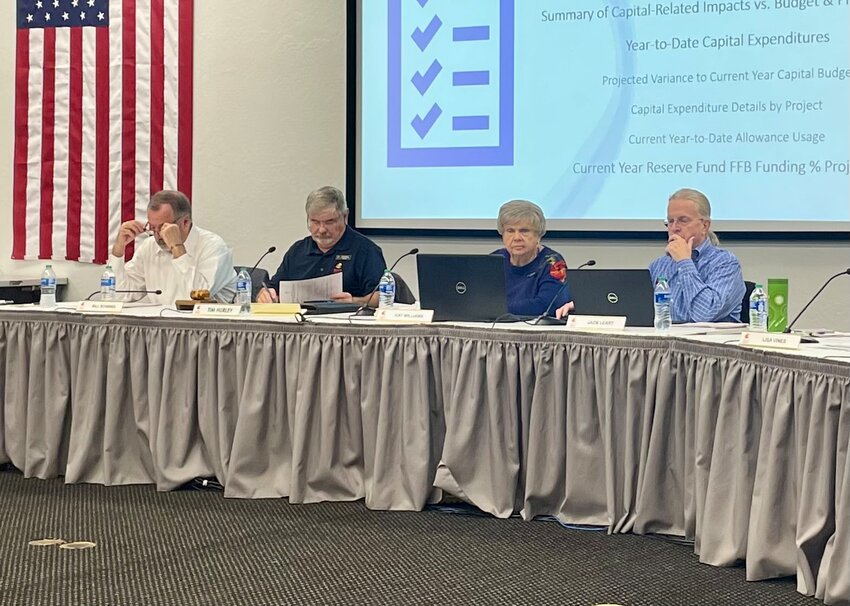 Bill Schwind, Tim Hurley, Kay Williams and Jack Leary during a recent governing board meeting in Sun City West.