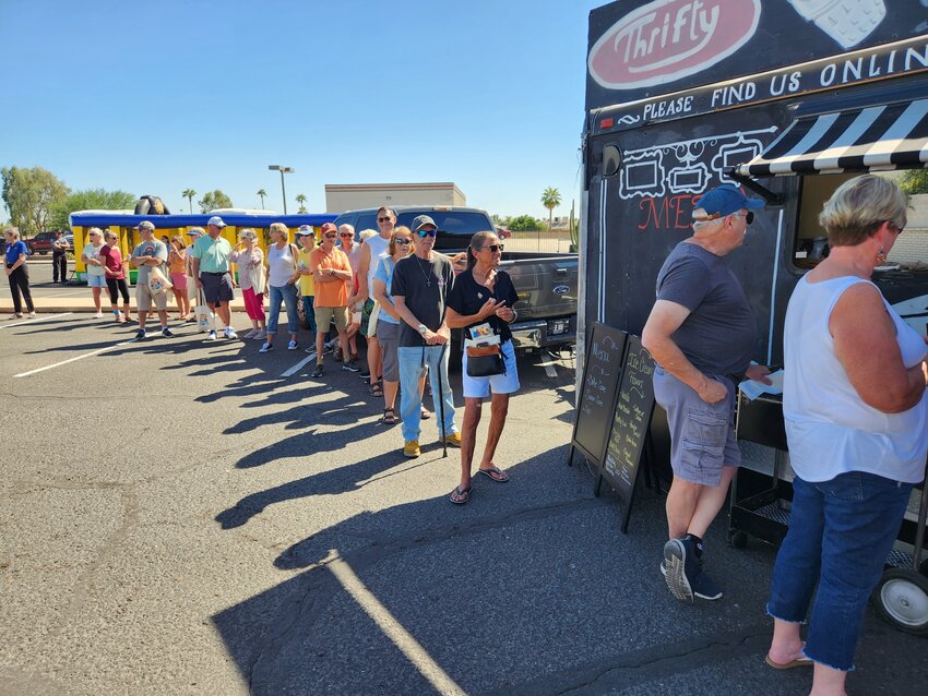 Participants at the 2023 Sun City Posse&rsquo;s 50th anniversary Fall Jubilee, which replaced the open house last year, line up for free ice cream.