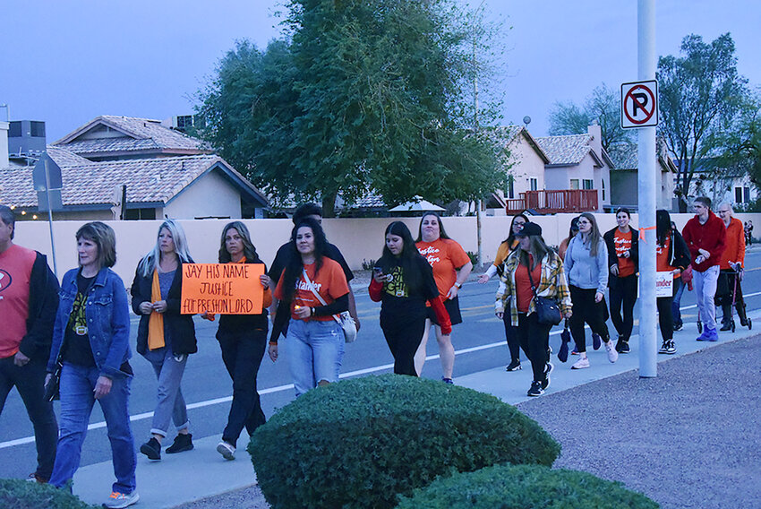 East Valley residents and others walked from a nearby school to Chandler Unified School District&rsquo;s office prior the CUSD Feb. 28 Governing Board meeting. Many wore orange in memory of slain teen Preston Lord and/or carried signs urging everyone to remember Lord and other victims or bullying or violence.