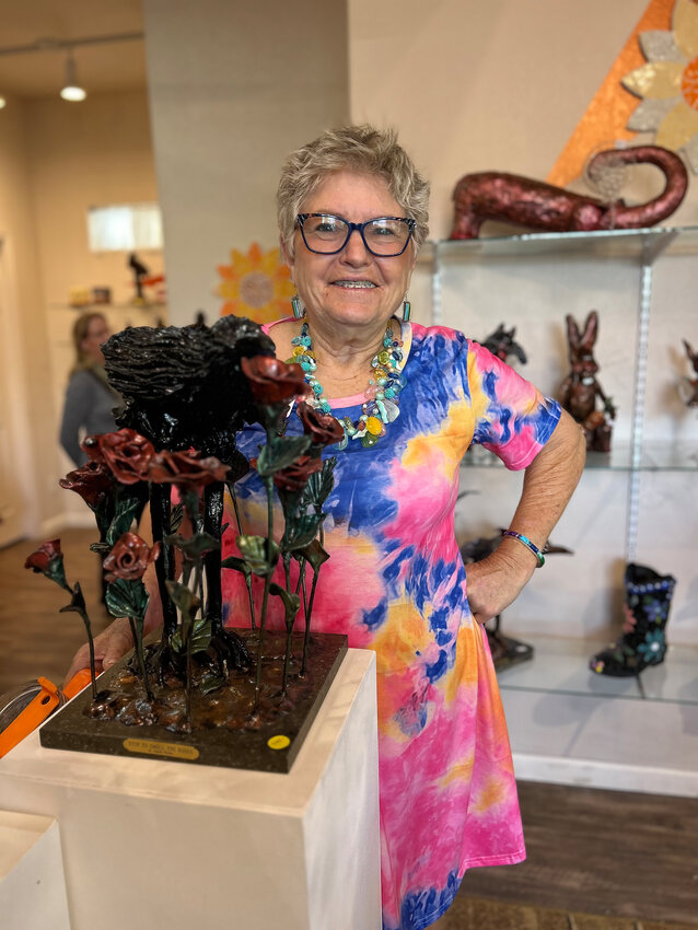 Joanie Wolter poses with &quot;Stop to Smell the Roses.&quot;