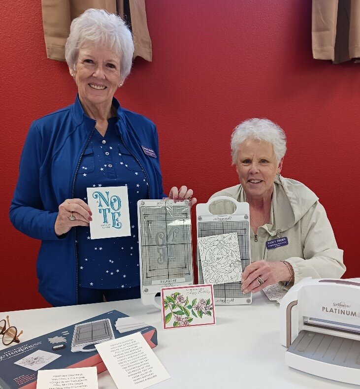 Susan Lukachie and Nancy Thorn created letter-pressed card samples while demonstrating the Letterpress device to members.